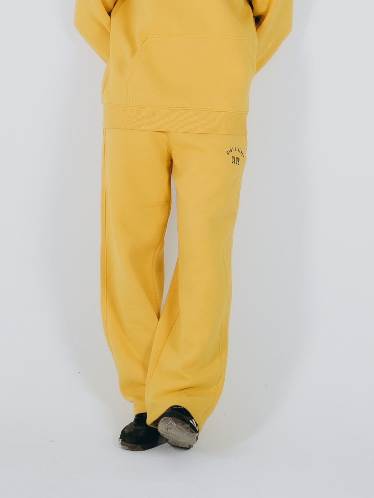 Unisex dust yellow sweatpants in a relaxed fit, crafted from premium Egyptian cotton with an ultra-soft finish, featuring an elastic waistband and ribbed cuffs – ideal for effortless style and all-day comfort.