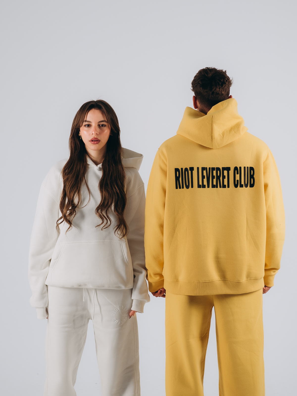 Unisex off-white and Yellow oversized hoodie, designed for effortless comfort and minimalist style, made from premium fleece fabric."
